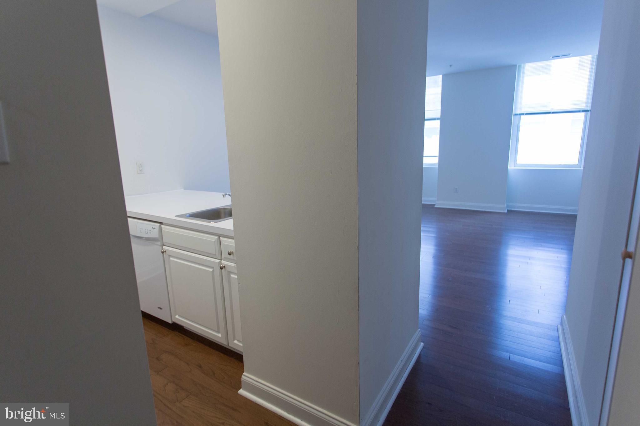 1600-2 Walnut Street, Unit 405 Philadelphia, PA 19103 - Photo 7 of 22 a view of a hallway with wooden floor