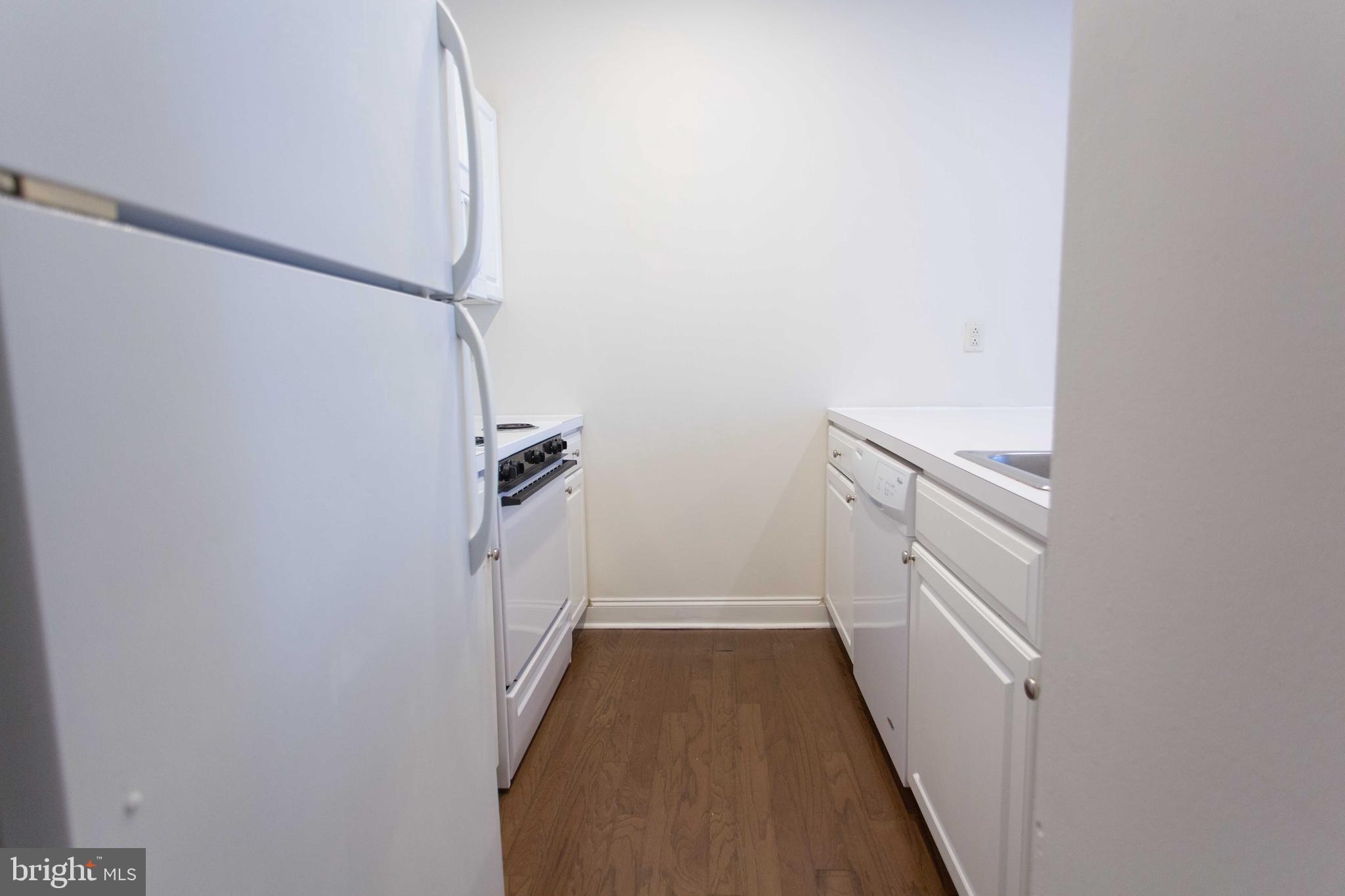 1600-2 Walnut Street, Unit 405 Philadelphia, PA 19103 - Photo 8 of 22 a view of a hallway with staircase