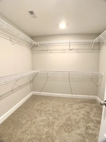 a view of a room with racks on the wall