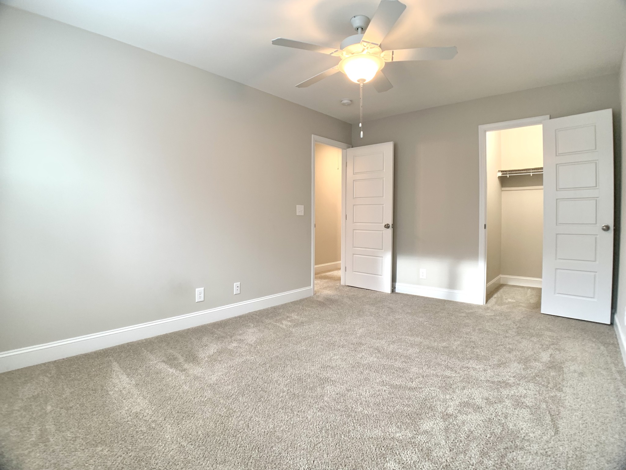 208 Copeland Road Clarksville, TN 37042 - Photo 26 of 35 an empty room with chandelier fan and windows