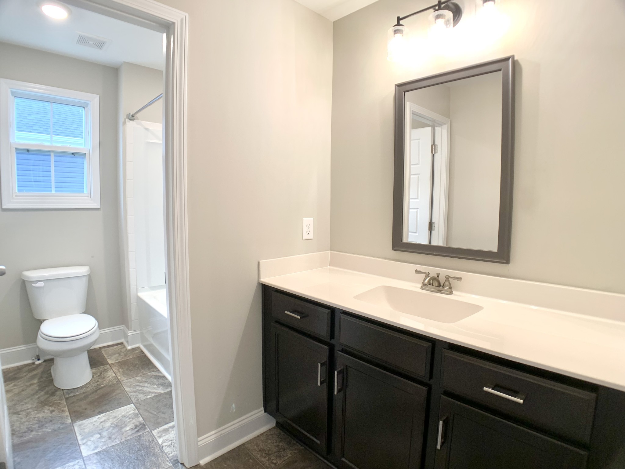 208 Copeland Road Clarksville, TN 37042 - Photo 27 of 35 a bathroom with a toilet sink and mirror