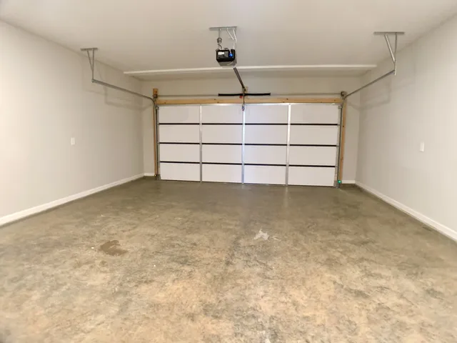 a view of a house with backyard and a garden