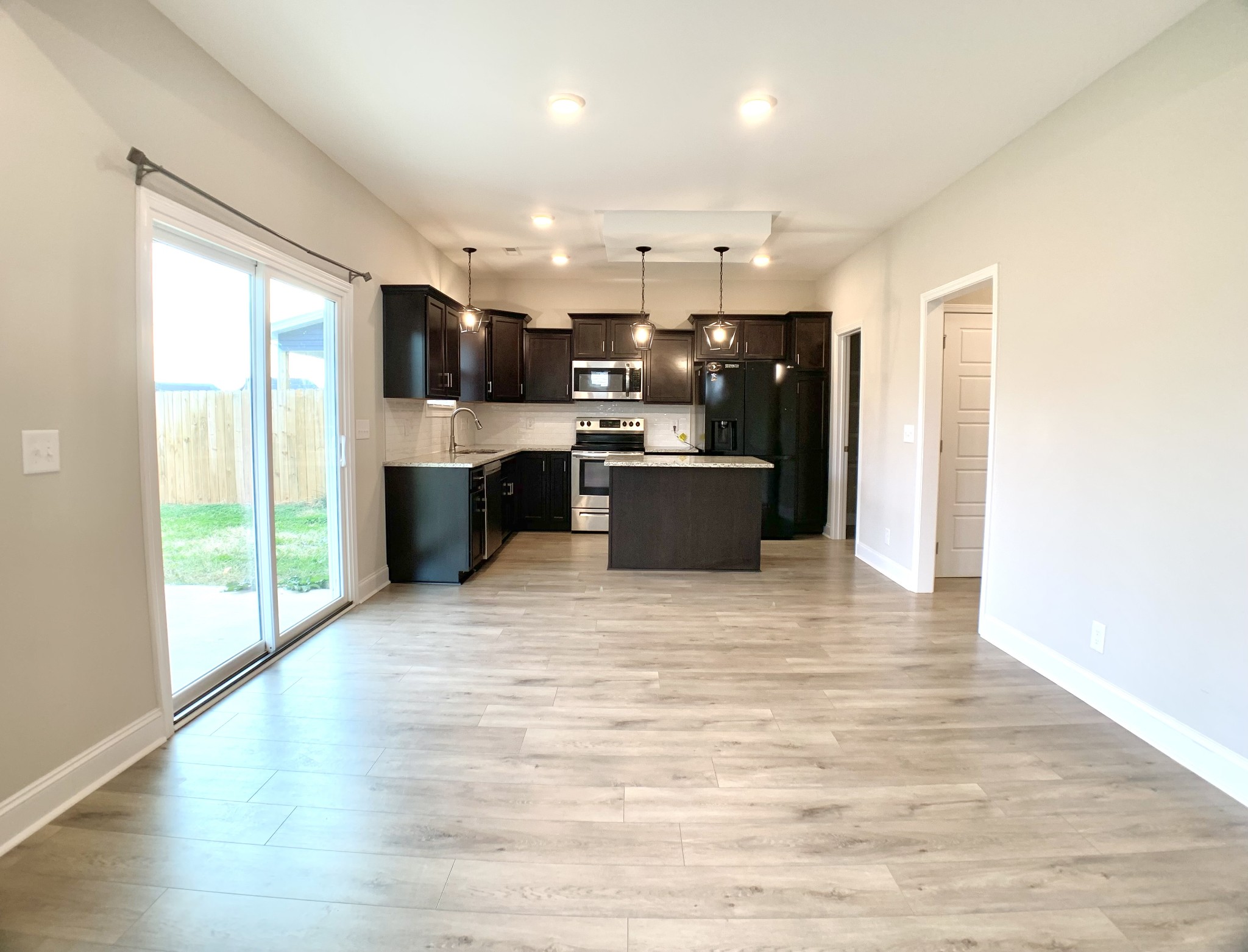 208 Copeland Road Clarksville, TN 37042 - Photo 6 of 35 a view of kitchen with stainless steel appliances granite countertop a refrigerator stove top oven and sink