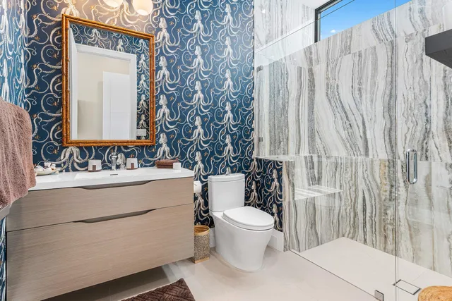 a bathroom with a toilet and a sink