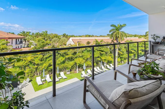 a view of a balcony with chairs