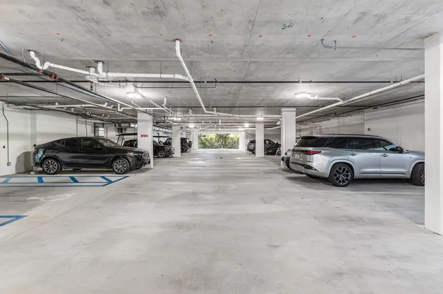 a view of parking garage with cars