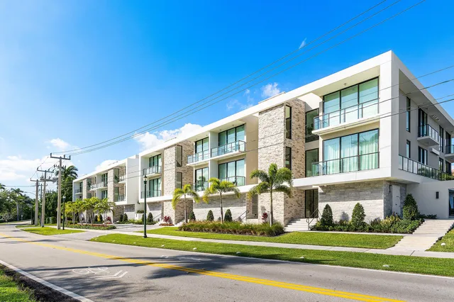 a front view of building with yard