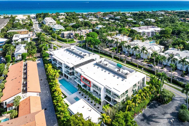 an aerial view of a residential houses with city view