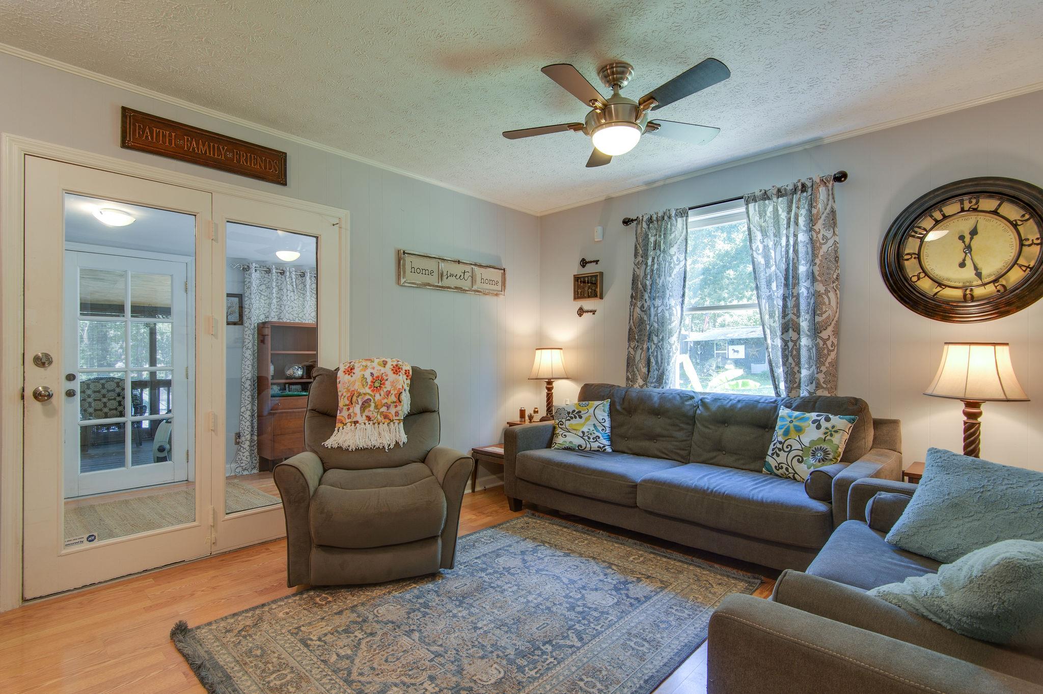 7116 Crow Cut Road Fairview, TN 37062 - Photo 12 of 30 a living room with furniture and a large window