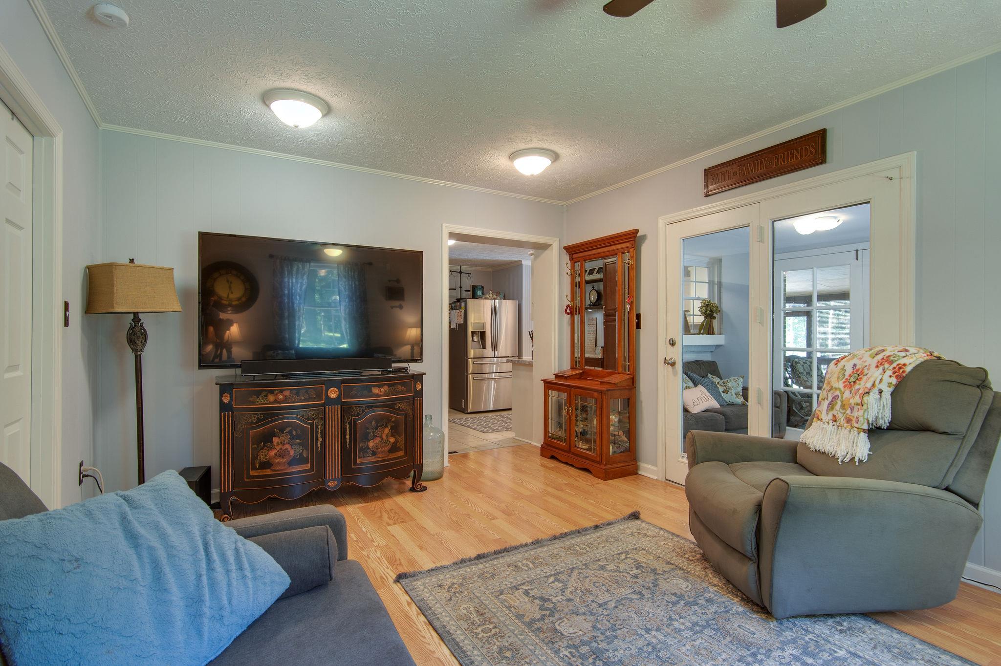 7116 Crow Cut Road Fairview, TN 37062 - Photo 13 of 30 a living room with furniture and a flat screen tv