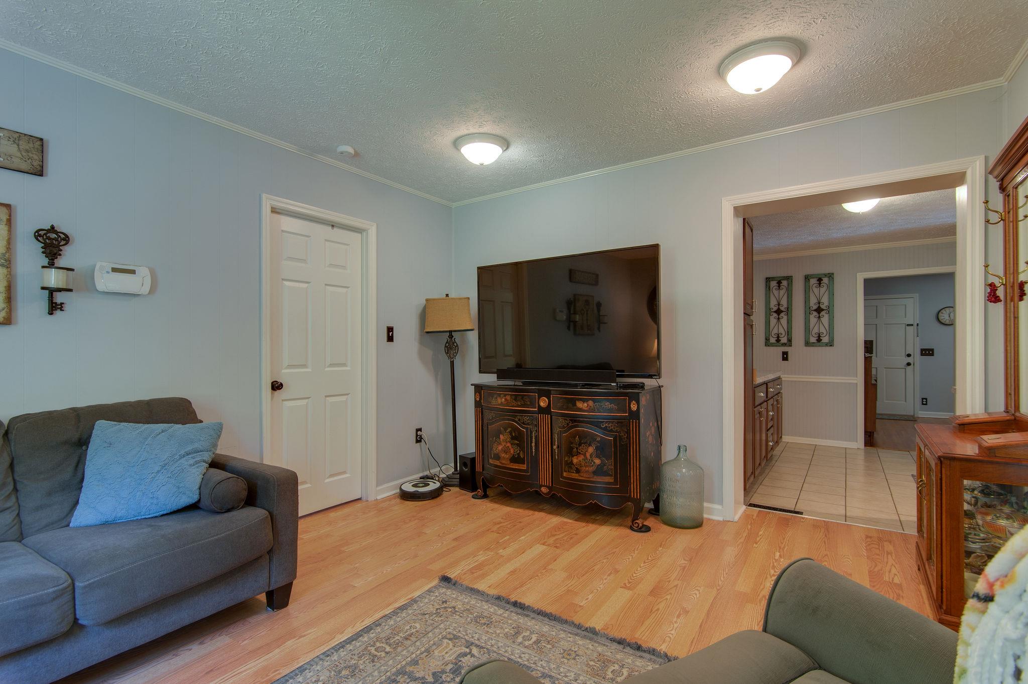 7116 Crow Cut Road Fairview, TN 37062 - Photo 14 of 30 a living room with furniture and a flat screen tv