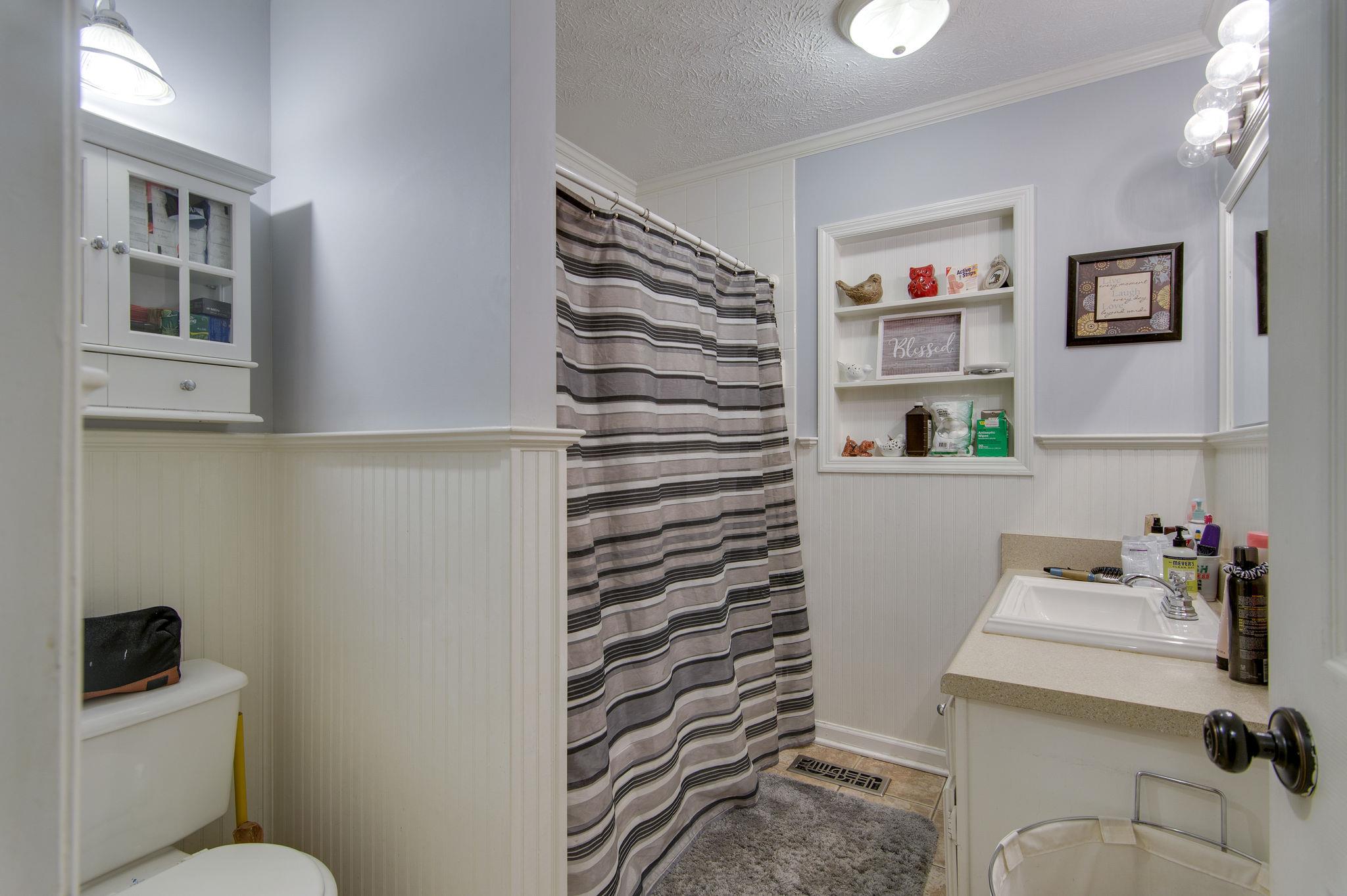 7116 Crow Cut Road Fairview, TN 37062 - Photo 22 of 30 a bathroom with a sink toilet and vanity