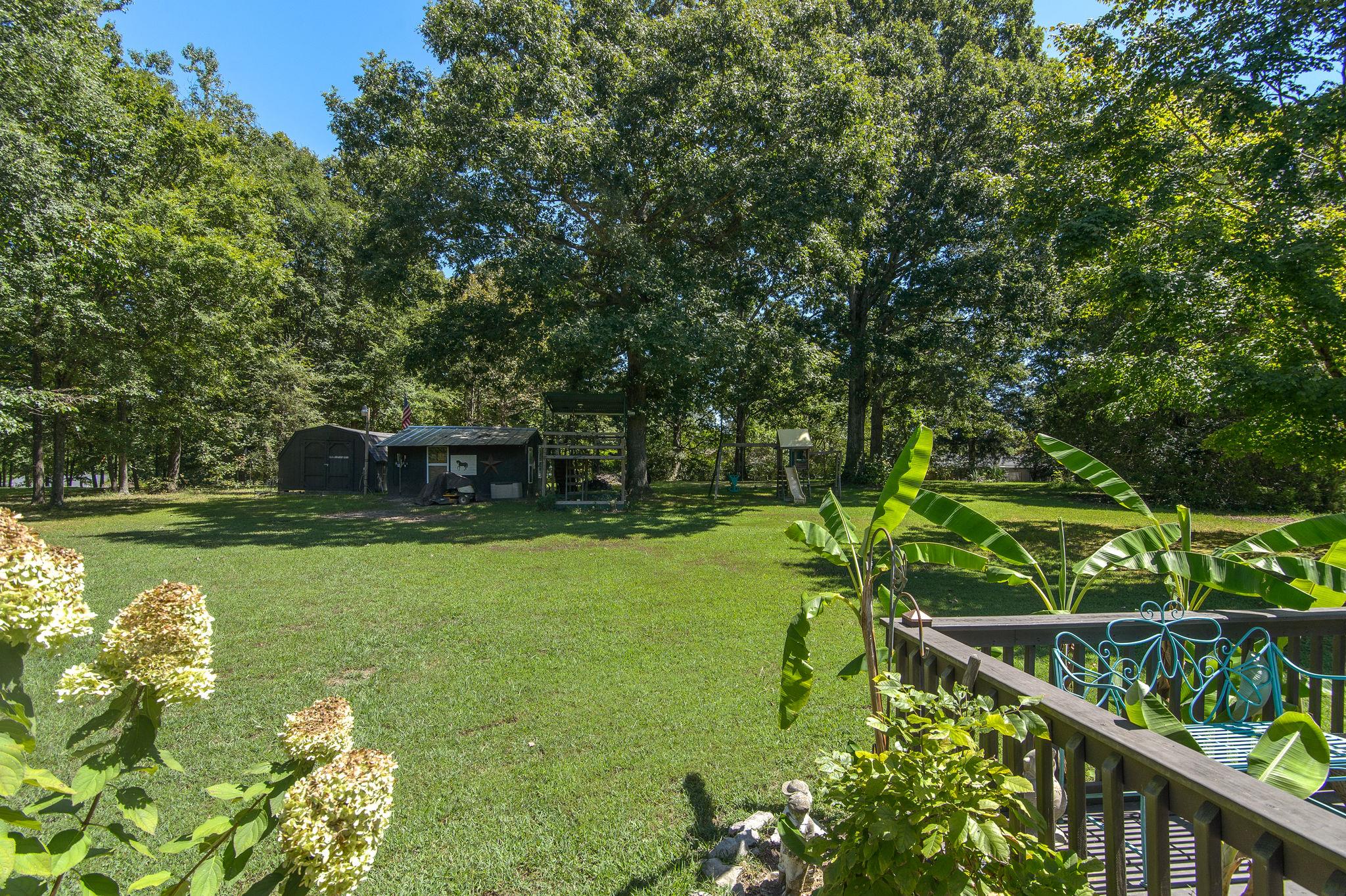 7116 Crow Cut Road Fairview, TN 37062 - Photo 28 of 30 a backyard of a house with lots of green space