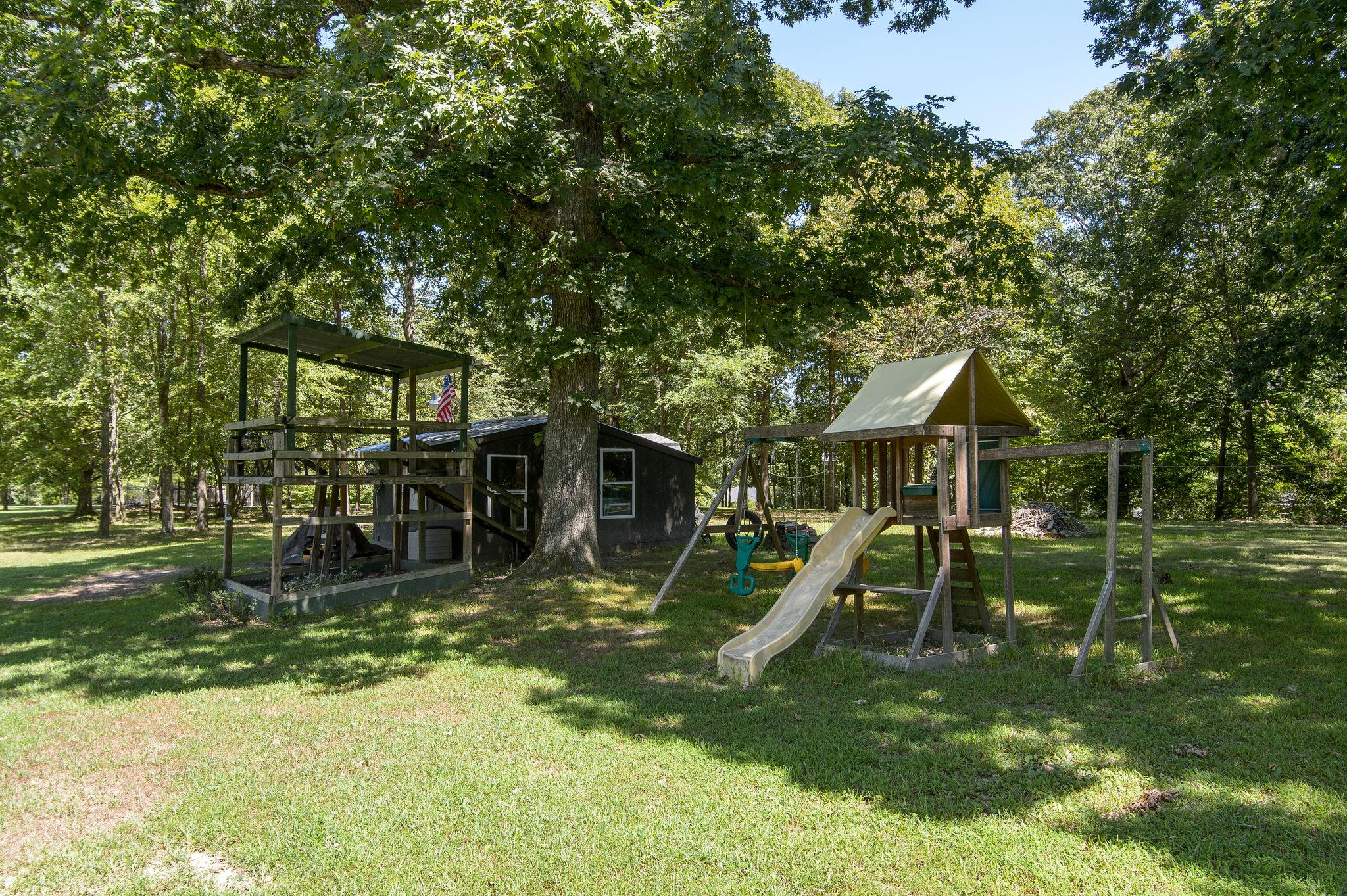 7116 Crow Cut Road Fairview, TN 37062 - Photo 29 of 30 a view of a house with a backyard