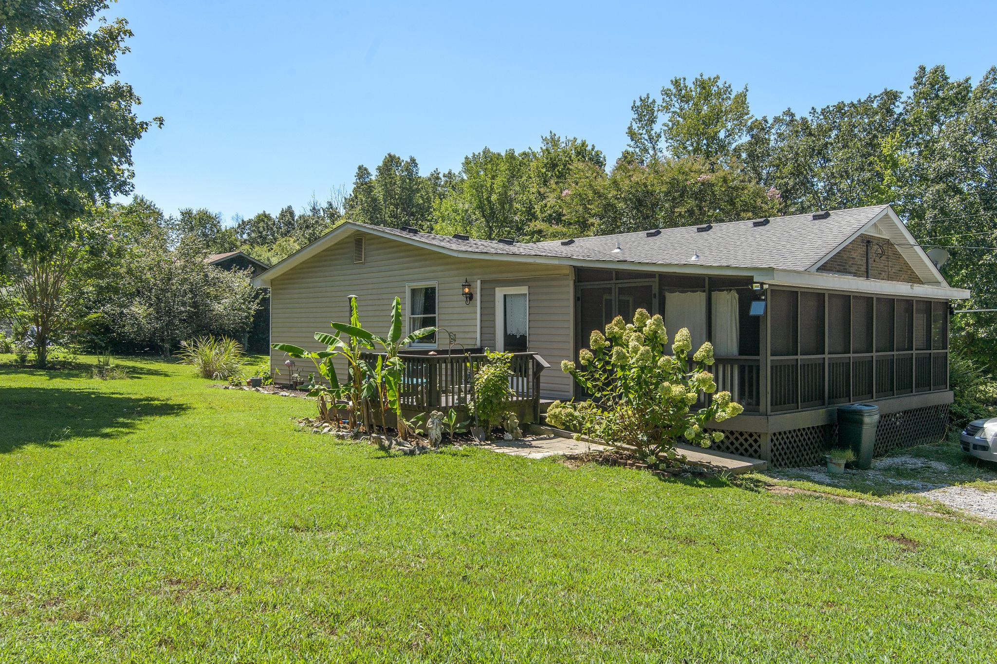 7116 Crow Cut Road Fairview, TN 37062 - Photo 30 of 30 a view of a house with garden and yard