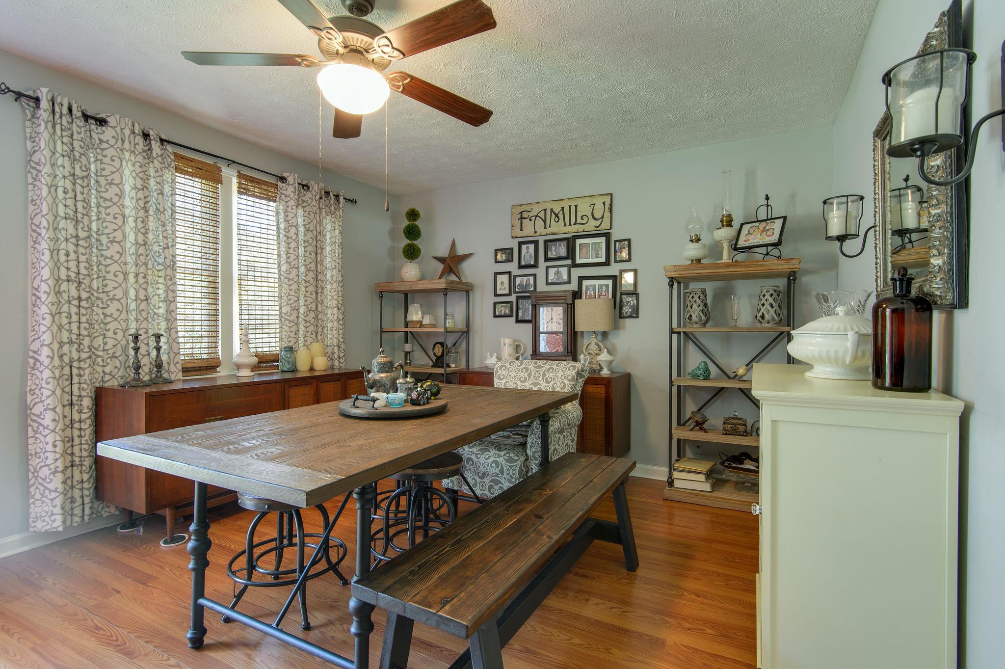 7116 Crow Cut Road Fairview, TN 37062 - Photo 5 of 30 a view of a dining room with furniture and a chandelier