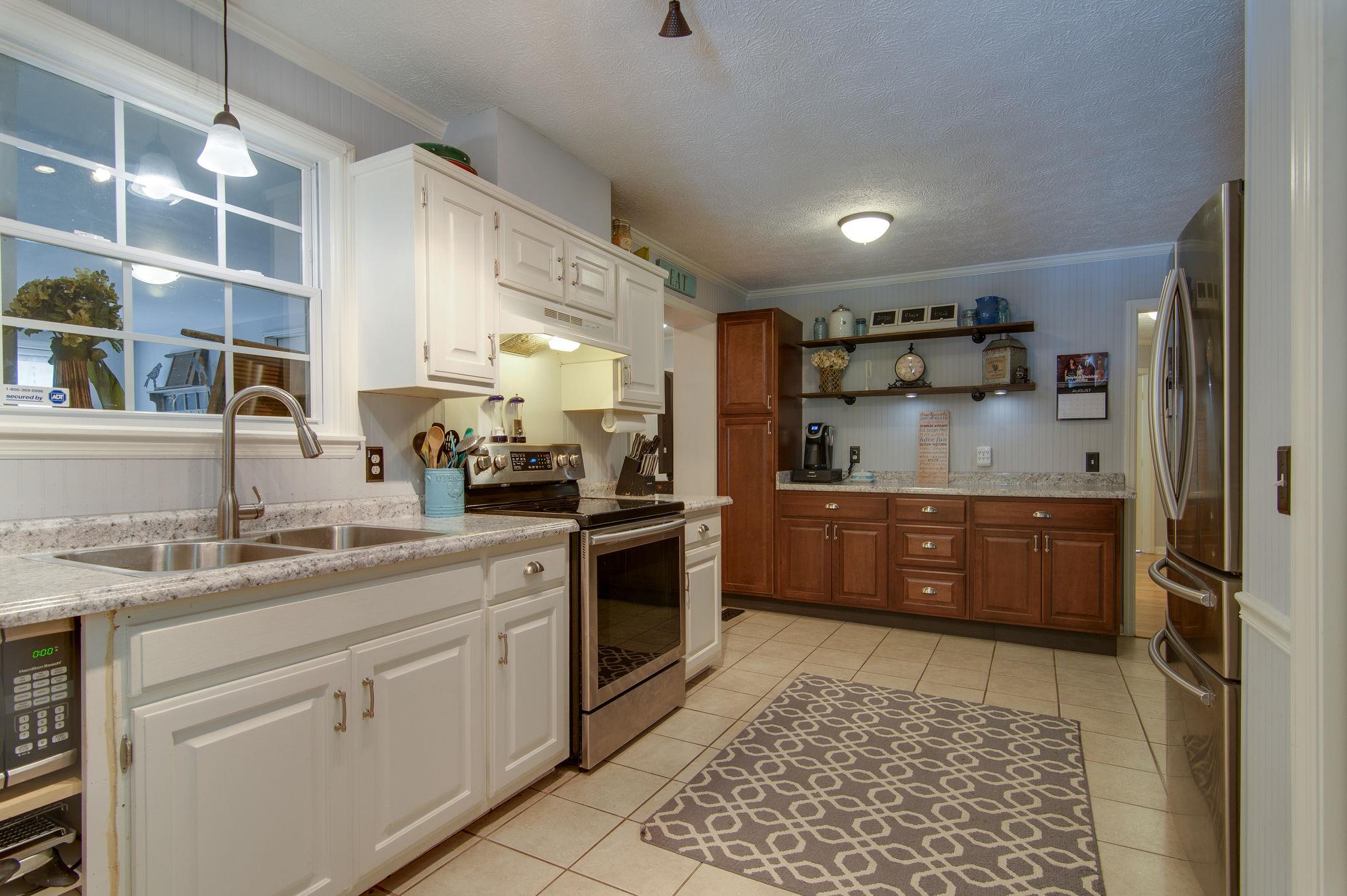7116 Crow Cut Road Fairview, TN 37062 - Photo 10 of 30 a kitchen with a sink cabinets and window