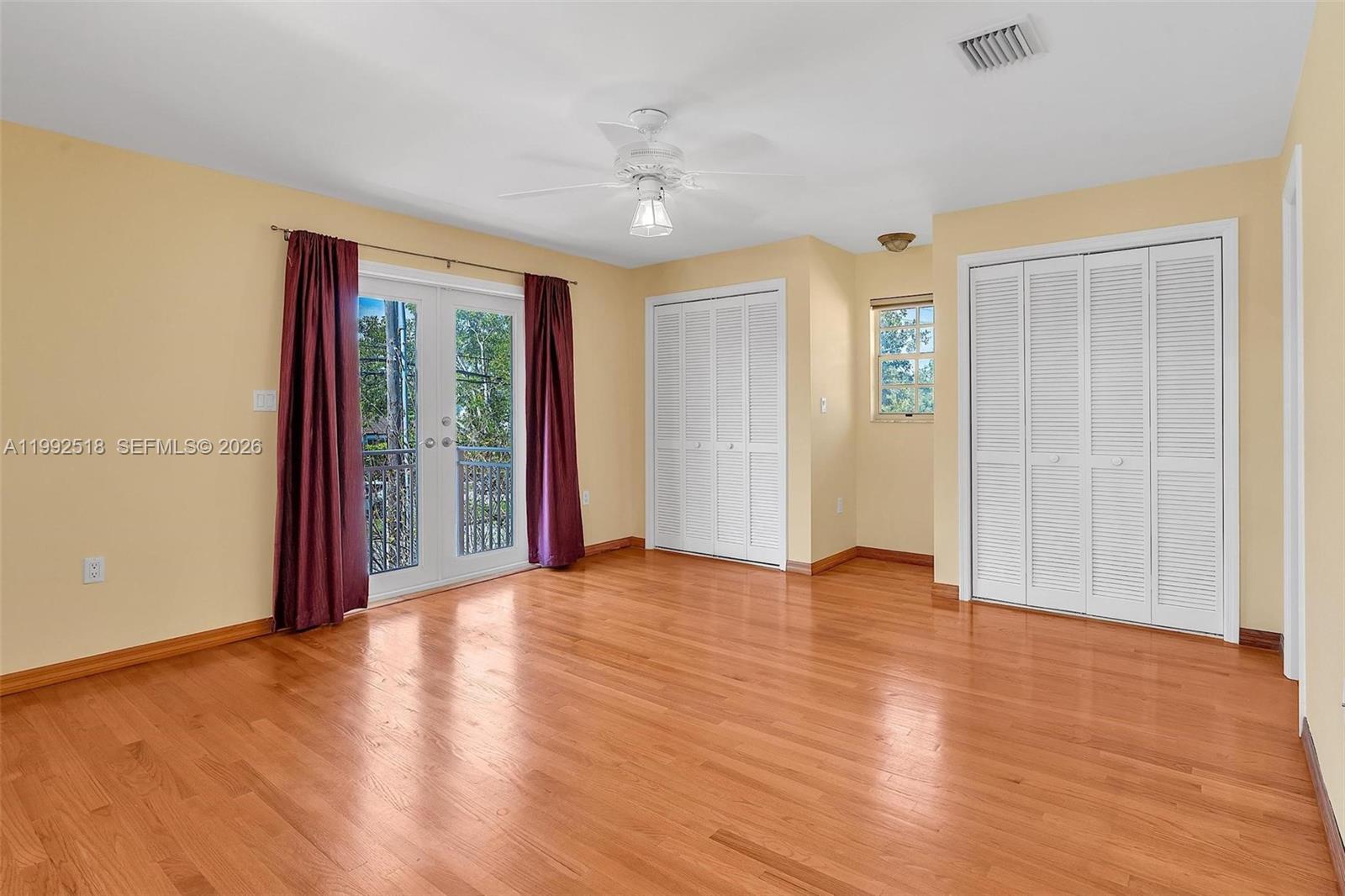 5309 Alton Road Miami Beach, FL 33140 - Photo 27 of 51 a view of an empty room with glass door and a window