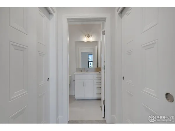 a view of a bathroom from a hallway