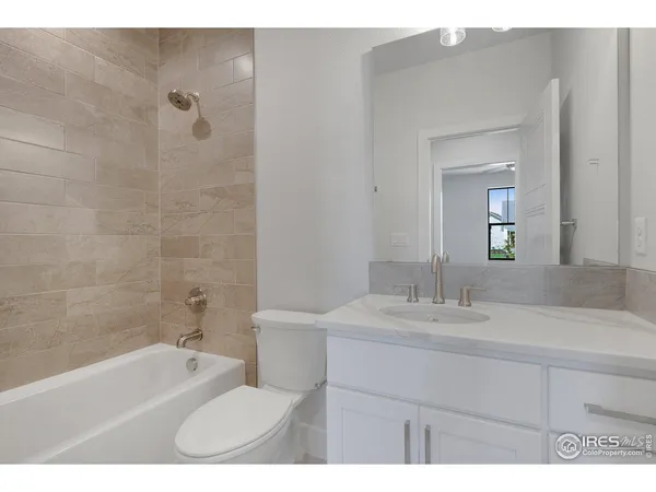 a bathroom with a sink a toilet and a bathtub