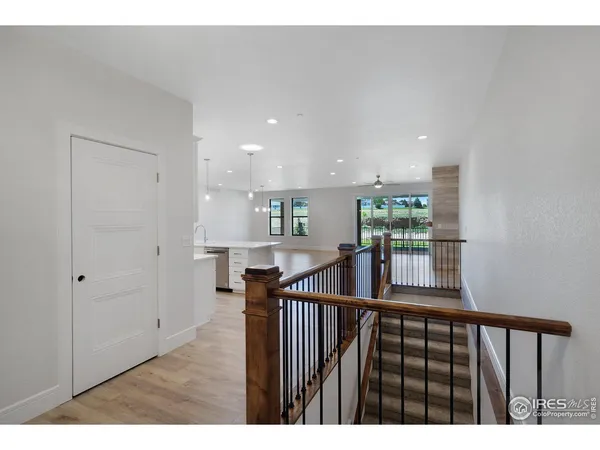 a view of kitchen with stainless steel appliances sink refrigerator and microwave