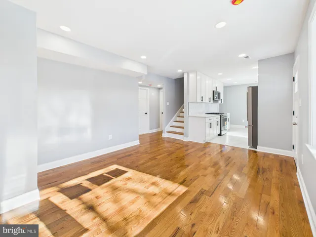 a kitchen with a sink stove and refrigerator
