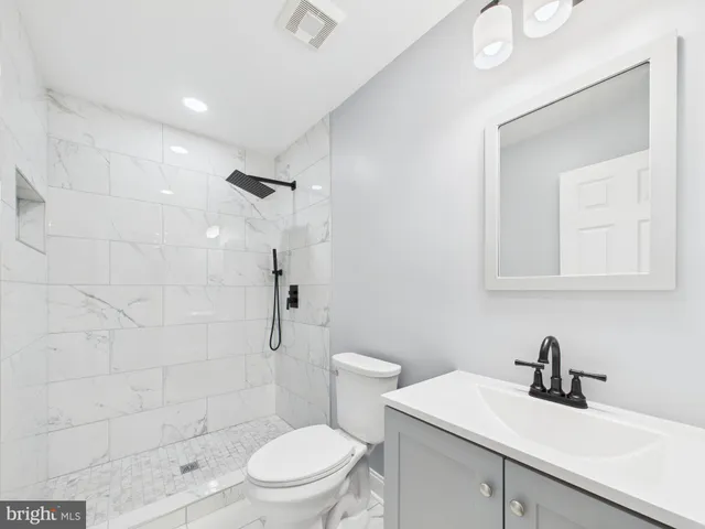 a bathroom with a shower and a shower