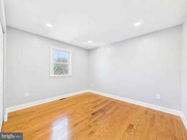 a view of a room with wooden floor and staircase