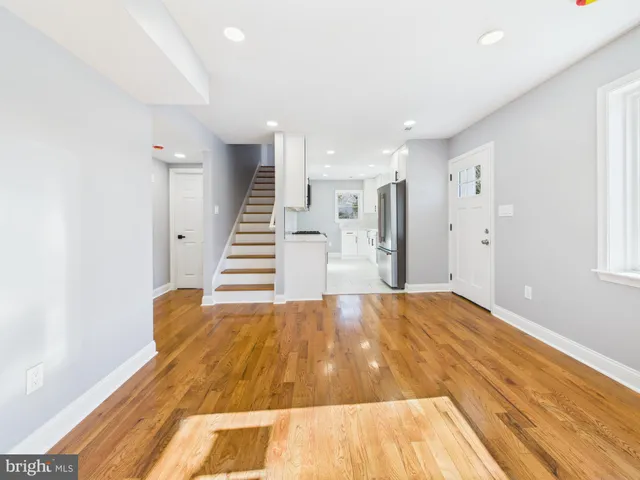 a view of a big room with wooden floor and closet