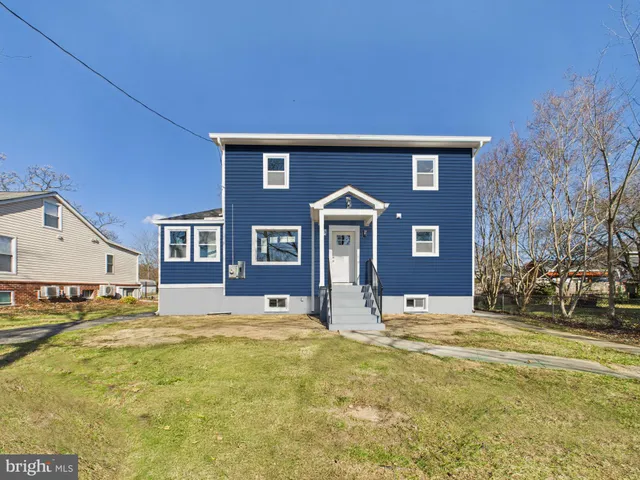a view of house with yard