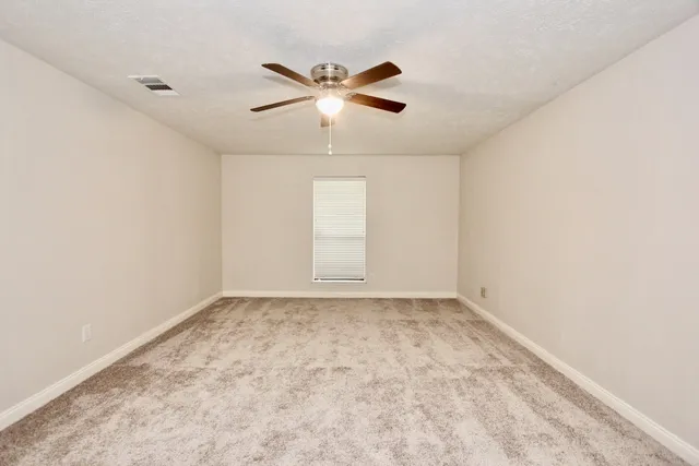 a en suite bathroom with a sink and a mirror