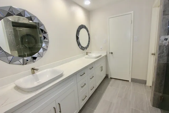 a bathroom with a glass shower door