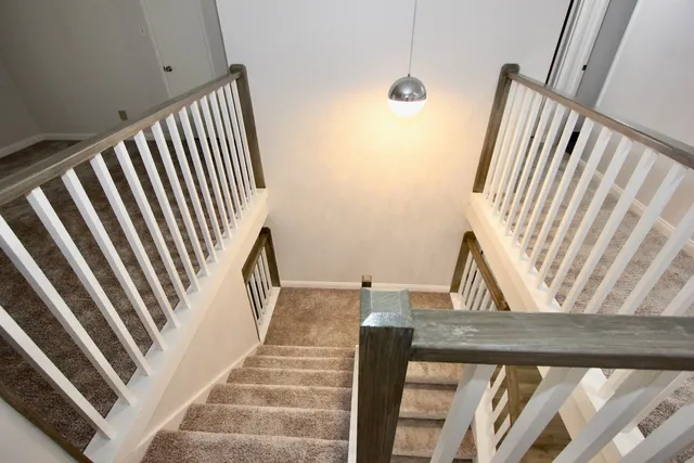 a view of a hallway with washer and dryer
