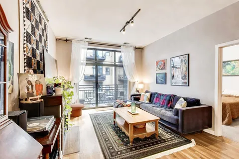 a living room with furniture fireplace and flat screen tv