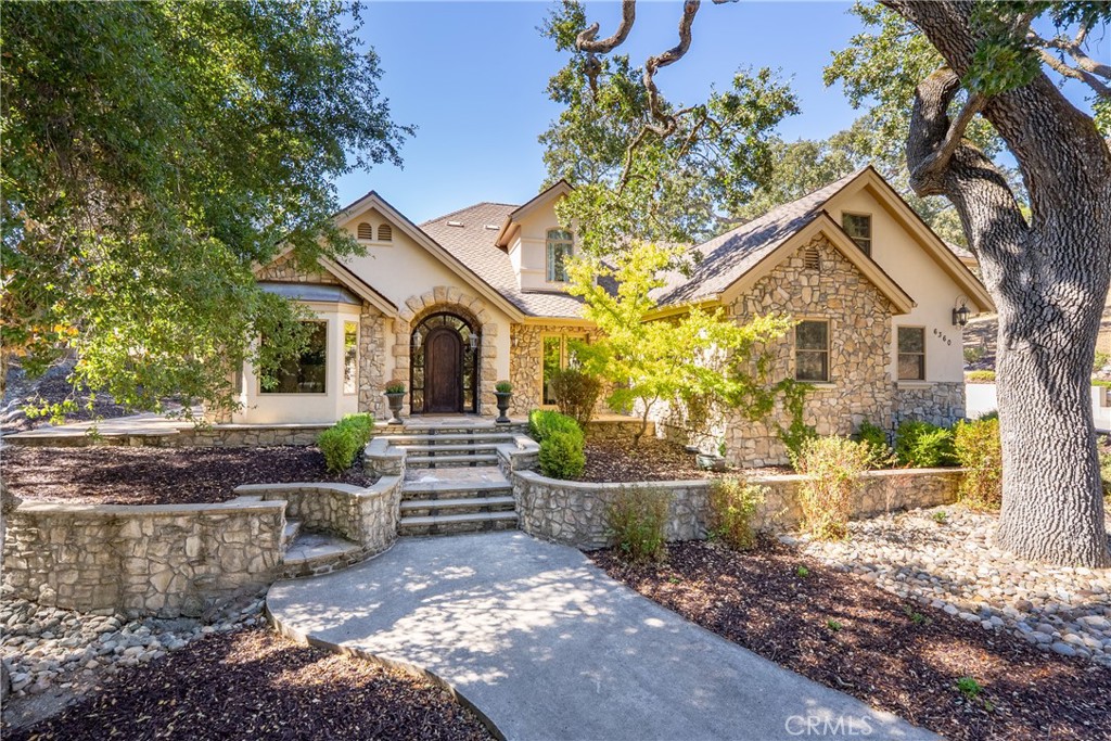 6360 Navarette Avenue Atascadero, CA 93422 - Photo 1 of 75 a front view of a house with a garden
