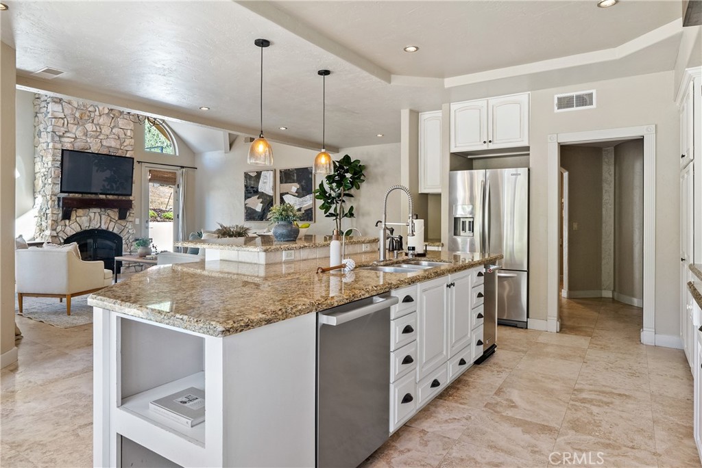 6360 Navarette Avenue Atascadero, CA 93422 - Photo 23 of 75 a kitchen with stainless steel appliances granite countertop a sink and a refrigerator