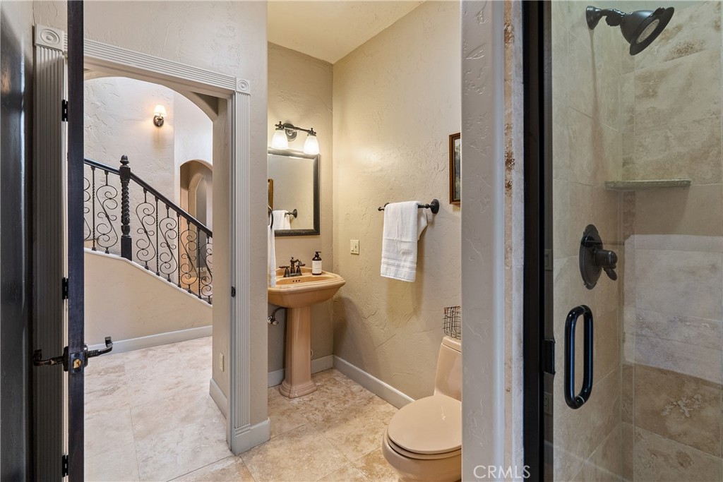 6360 Navarette Avenue Atascadero, CA 93422 - Photo 29 of 75 a bathroom with a granite countertop shower and a toilet