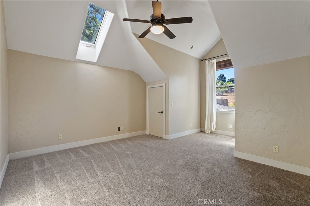 6360 Navarette Avenue Atascadero, CA 93422 - Photo 41 of 75 Bedroom 2 features plush carpet, a skylight, vaulted ceilings and two closets.
