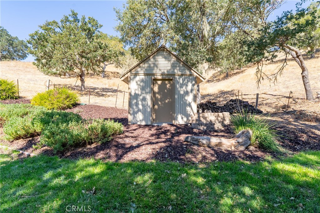 6360 Navarette Avenue Atascadero, CA 93422 - Photo 52 of 75 Out front you will find a lush lawn and storage shed ideal for yard maintenance tools.