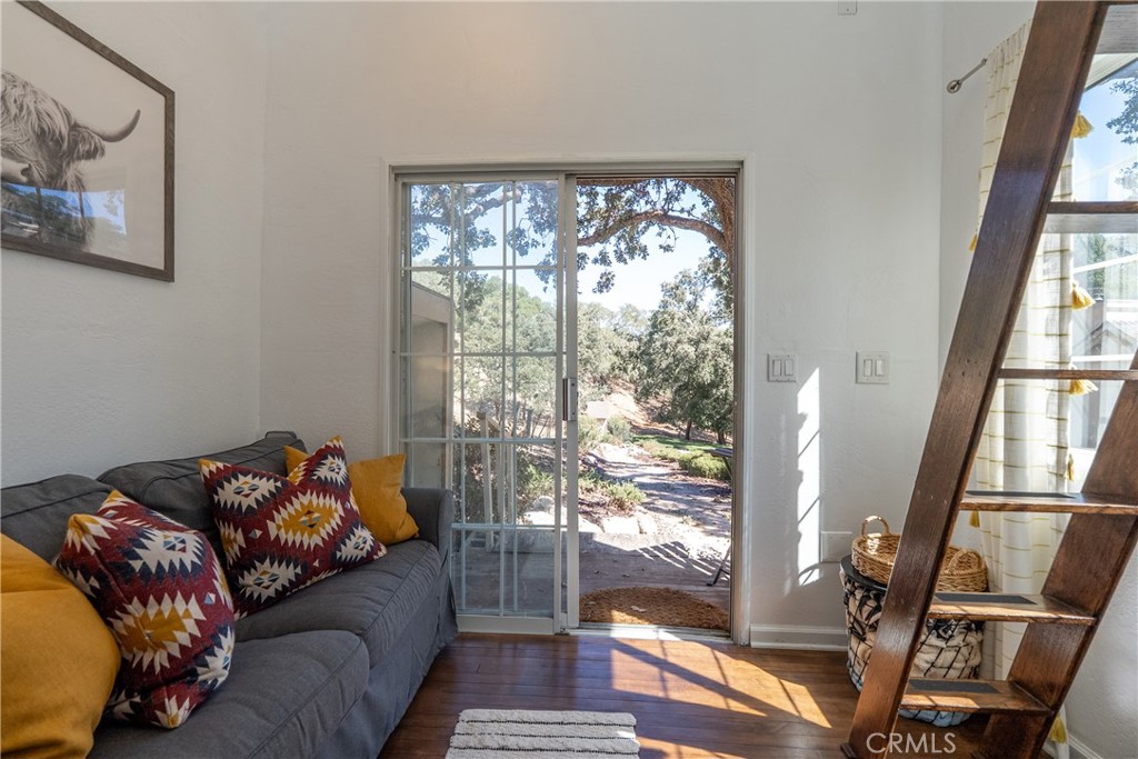 6360 Navarette Avenue Atascadero, CA 93422 - Photo 57 of 75 a living room with furniture and a floor to ceiling window