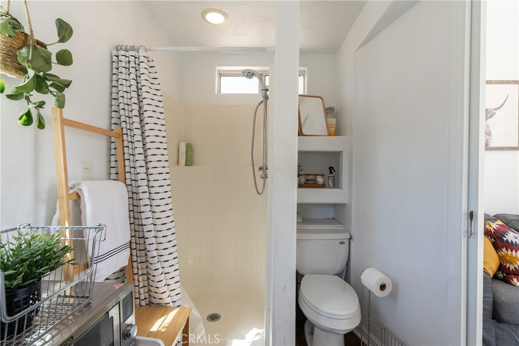 6360 Navarette Avenue Atascadero, CA 93422 - Photo 62 of 75 The bathroom area has a commode and walk in shower.