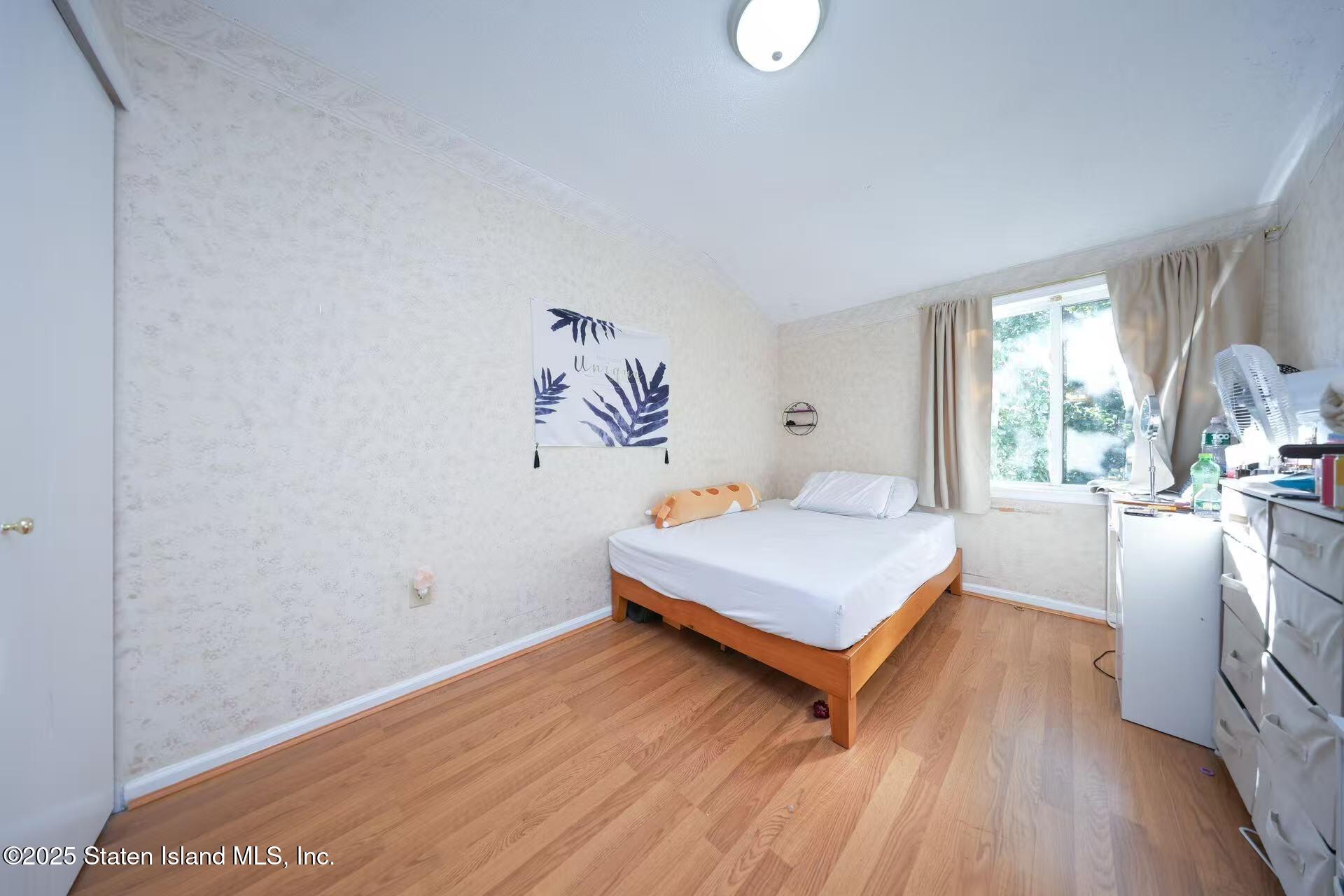 78 Emily Lane Staten Island, NY 10312 - Photo 15 of 24 a living room with furniture and a table