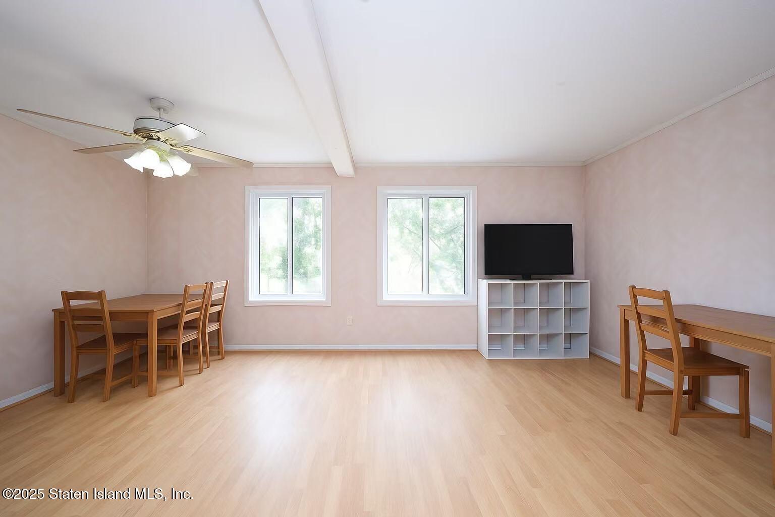 78 Emily Lane Staten Island, NY 10312 - Photo 4 of 24 a view of a livingroom with furniture and a flat screen tv