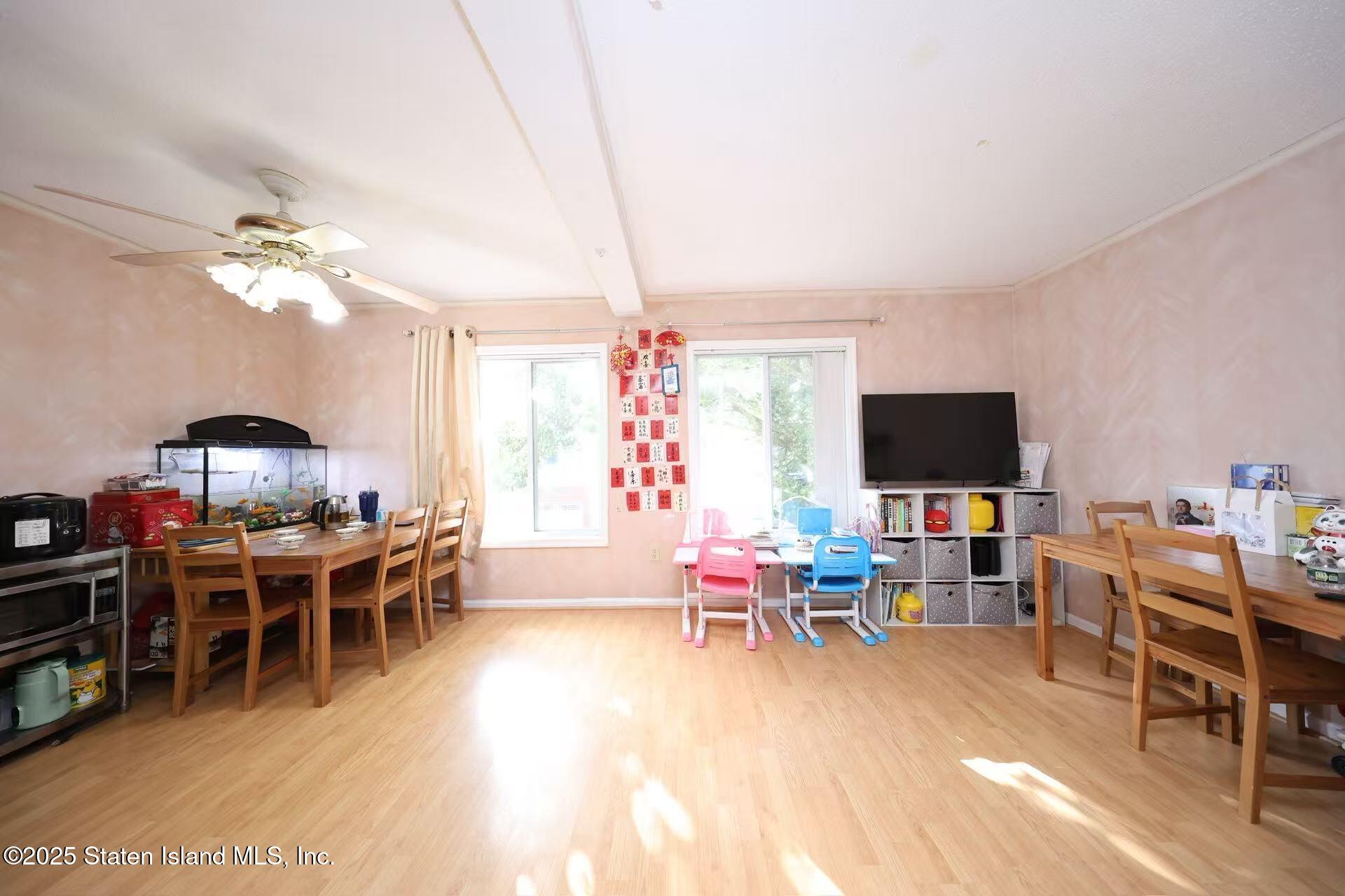 78 Emily Lane Staten Island, NY 10312 - Photo 5 of 24 a living room with furniture and a flat screen tv