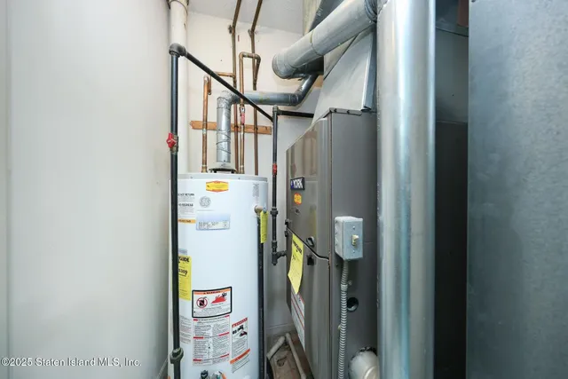a view of hallway with stairs and wooden floor