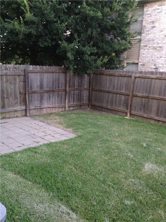 1110 Spring Loop, Unit C College Station, TX 77840 - Photo 6 of 6 a view of a backyard with a small cabin and wooden fence