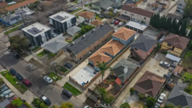an aerial view of residential house with outdoor space and parking