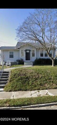 a view of a yard with an outdoor seating