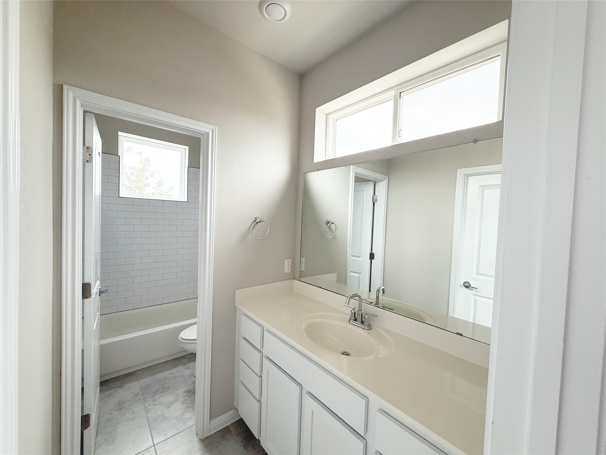 9015 Cattle Baron Path, Unit 605 Austin, TX 78747 - Photo 7 of 20 jack and jill Bathroom with toilet and vanity
