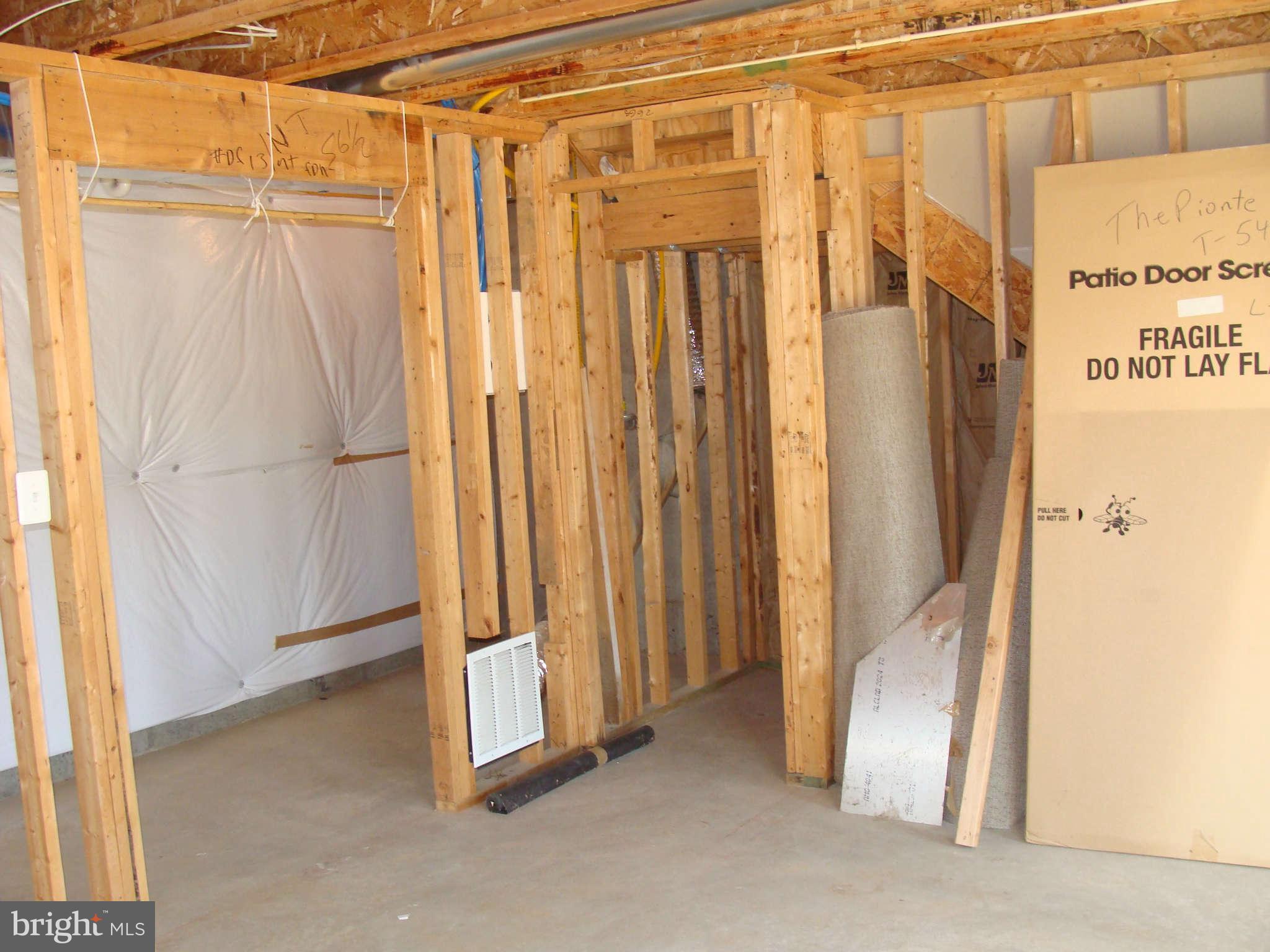 17686 Possum Point Road Dumfries, VA 22026 - Photo 19 of 23 a view of a bathroom with a shower and a tub